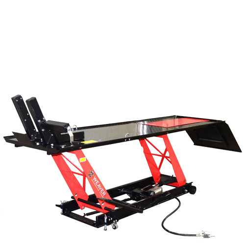 Weaver W-1000 motorcycle lift raised on a red scissor frame, with a black diamond-plate deck, front wheel vise, and air-line control.
